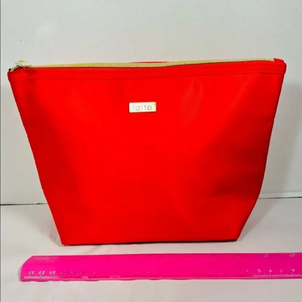 Tarte red cosmetic bag/ clutch, nice size with beautiful purple satin interior